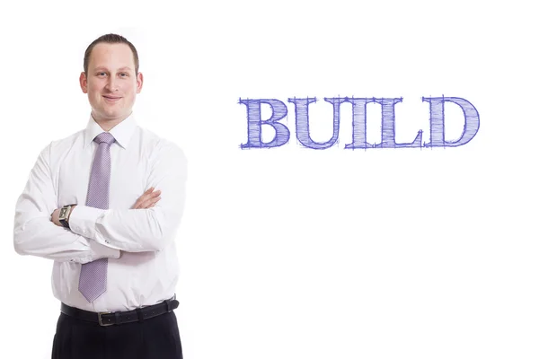 Build - fiatal üzletember, kék szöveggel — Stock Fotó