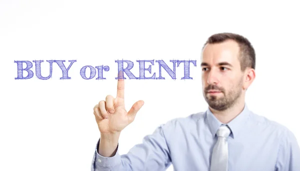 Купить или арендовать - Молодой бизнесмен с синим текстом — стоковое фото