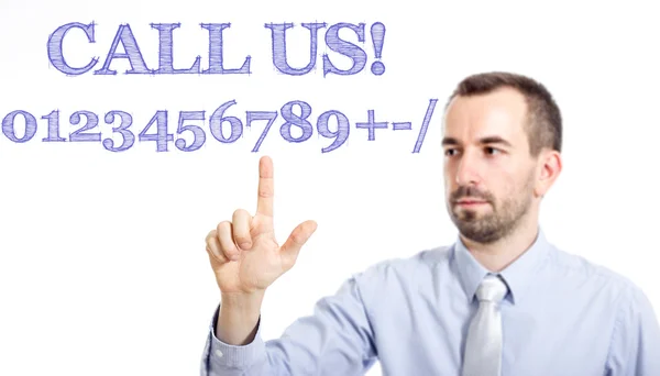 Rufen Sie uns an! Jungunternehmer mit kleinem Bart rührt Text an — Stockfoto