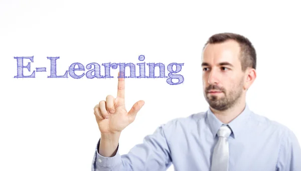 E-learning - Joven hombre de negocios con texto azul —  Fotos de Stock