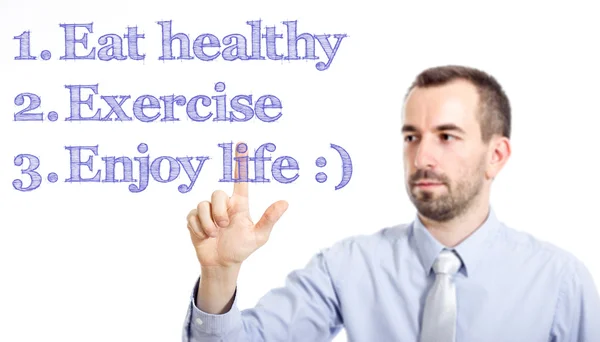 Manger sainement, faire de l'exercice, profiter de la vie Jeune homme d'affaires avec une petite barbe texte touchant — Photo