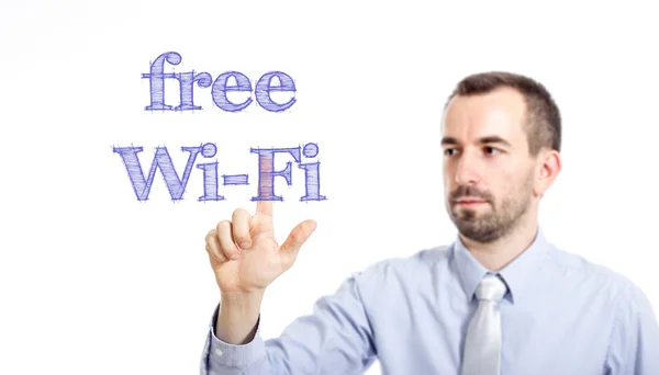 Free Wi-Fi  - Young businessman with blue text — Stock Photo, Image