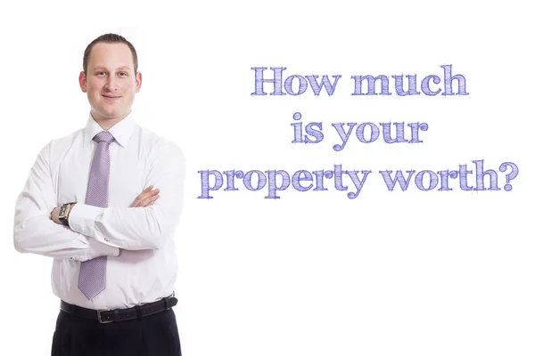 Kolik je vaše nemovitost stojí? -Mladý podnikatel s modrým textem — Stock fotografie