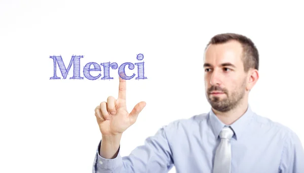 Merci - Joven hombre de negocios con texto azul — Foto de Stock