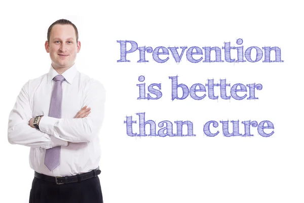 Prevenir es mejor que curar - Joven hombre de negocios con texto azul —  Fotos de Stock