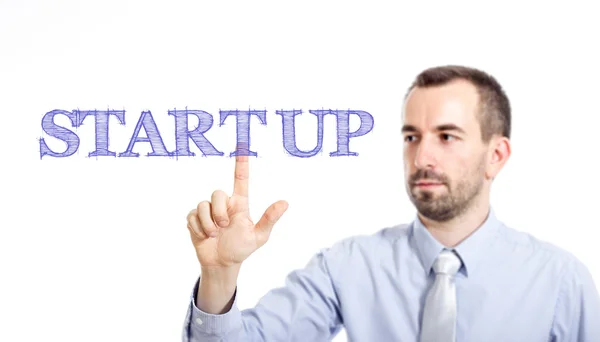 Start Up - Jovem empresário com texto azul — Fotografia de Stock