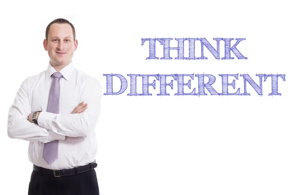 Pensar diferente - Jovem empresário com texto azul — Fotografia de Stock