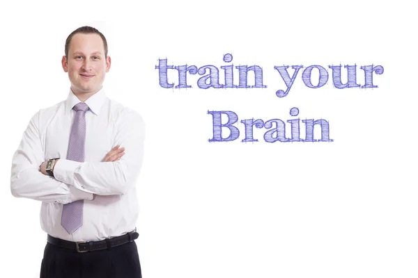 Entrenar su cerebro - Joven hombre de negocios con texto azul —  Fotos de Stock