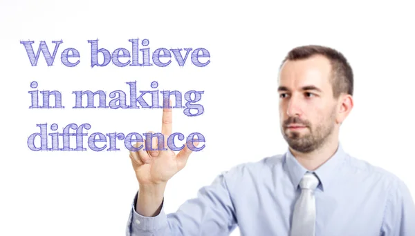 We believe in making difference - Young businessman with blue text — Stock Photo, Image