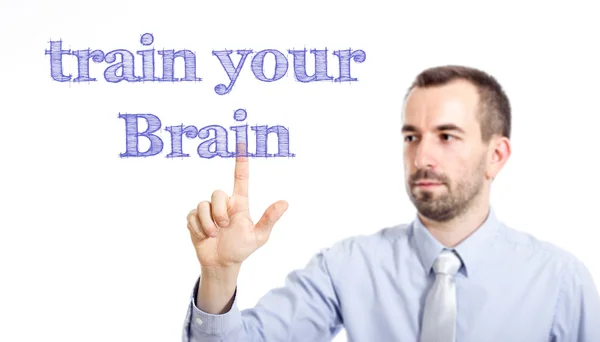 Train je hersenen - jonge zakenman met blauwe tekst — Stockfoto