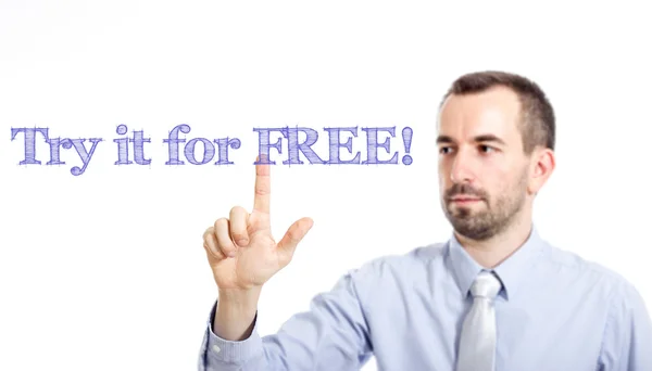 Try it for free - Young businessman with blue text — Stock Photo, Image