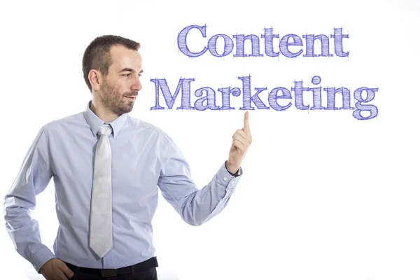 Content Marketing - ung affärsman med blå text — Stockfoto