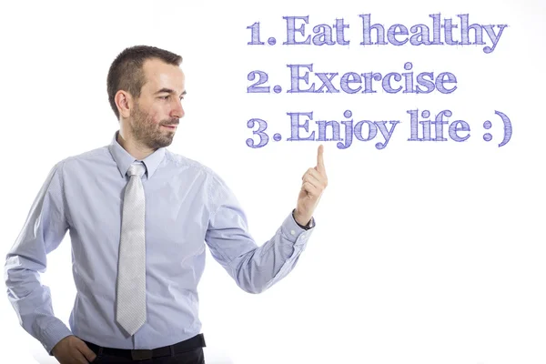 Manger sainement, faire de l'exercice, profiter de la vie - Jeune homme d'affaires avec le texte bleu — Photo
