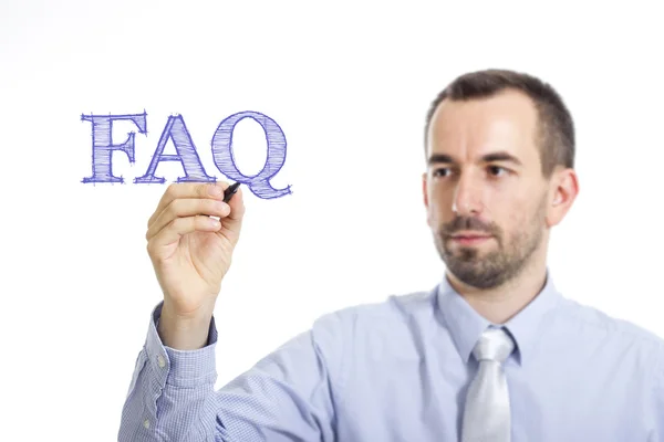 FAQ - ung affärsman med blå text — Stockfoto