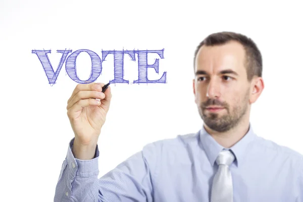 Hlasování - mladý podnikatel s modrým textem — Stock fotografie