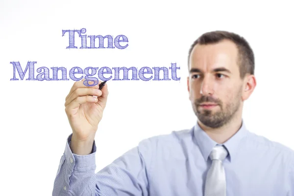 Управление временем - Молодой бизнесмен с синим текстом — стоковое фото