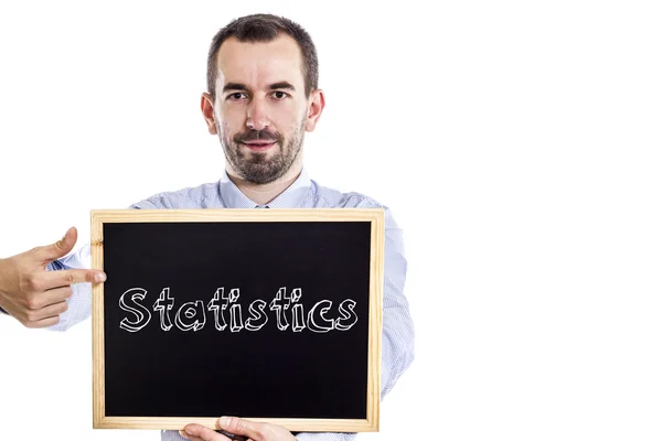 Statistics - Young businessman with blackboard — Stock Photo, Image