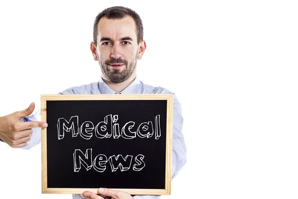 Medical News - fiatal üzletember tábla — Stock Fotó