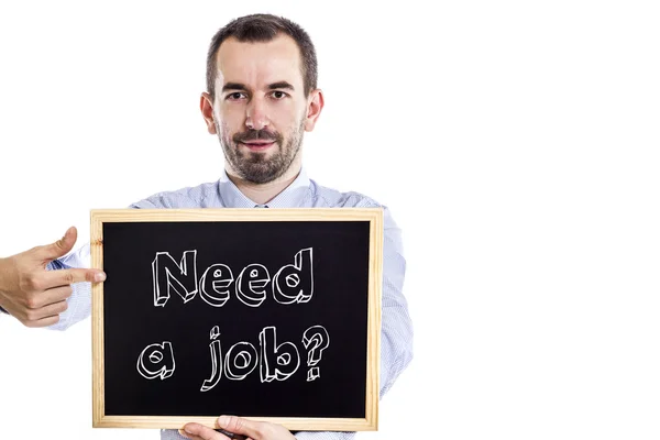 Einen Job brauchen? - Jungunternehmer mit Tafel - isoliert auf weiß — Stockfoto