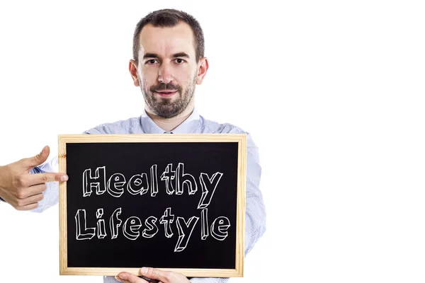 Zdrowy styl życia - młody biznesmen z tablicy — Zdjęcie stockowe