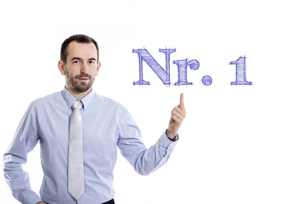 Nr. 1 - Joven hombre de negocios con barba pequeña apuntando hacia arriba en camisa azul —  Fotos de Stock