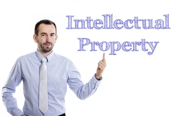 Propriedade Intelectual - Jovem empresário com texto azul — Fotografia de Stock