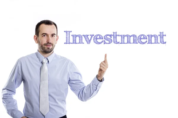 Investice - mladý podnikatel s modrým textem — Stock fotografie