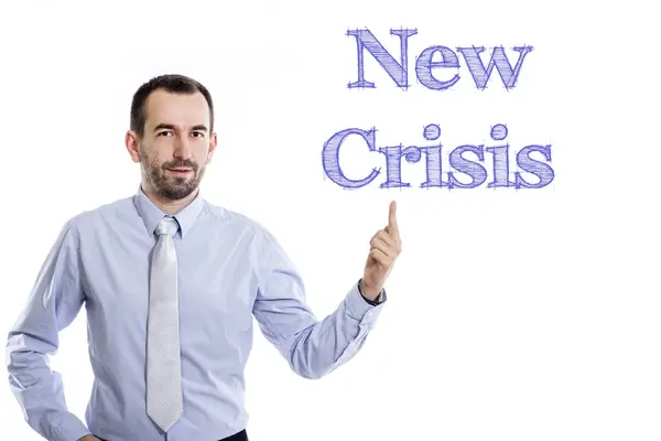 Новый кризис - Молодой бизнесмен с синим текстом — стоковое фото