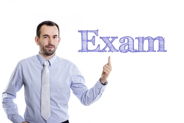 Examen - Joven hombre de negocios con texto azul — Foto de Stock