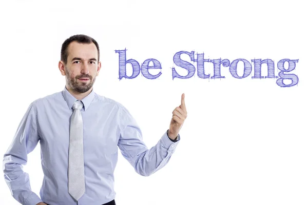 Ser fuerte - Joven hombre de negocios con texto azul — Foto de Stock