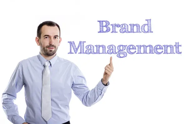 Brand Management - Young businessman with blue text — Stock Photo, Image