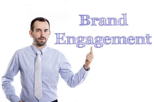 Brand Engagement - Young businessman with blue text — Stock Photo, Image