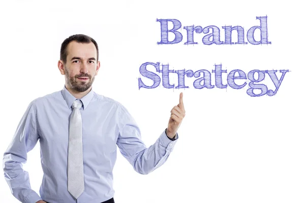 Brand Strategy - Young businessman with blue text — Stock Photo, Image