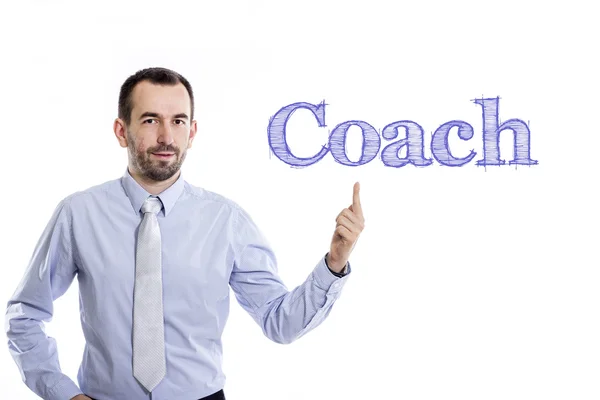 Coach - Young businessman with blue text — Stock Photo, Image