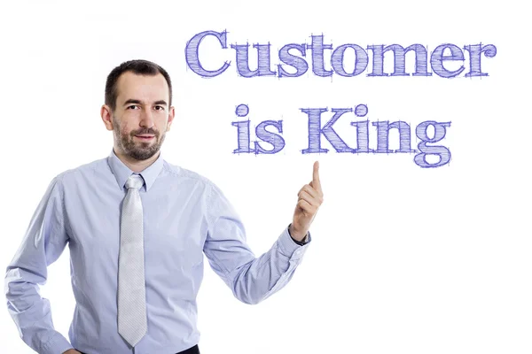 Klant is koning - jonge zakenman met blauwe tekst — Stockfoto