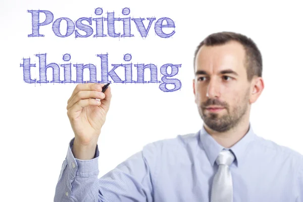 Позитивное мышление - Молодой бизнесмен пишет синий текст — стоковое фото