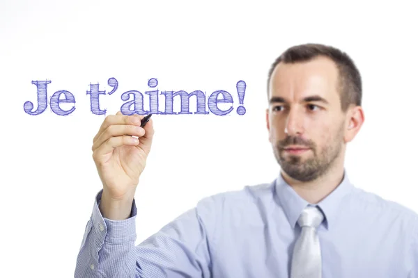 ¡Je t 'aime! - Joven empresario escribiendo texto azul — Foto de Stock