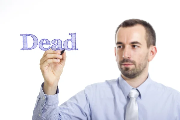 Morto - Jovem empresário escrevendo texto azul na superfície transparente — Fotografia de Stock