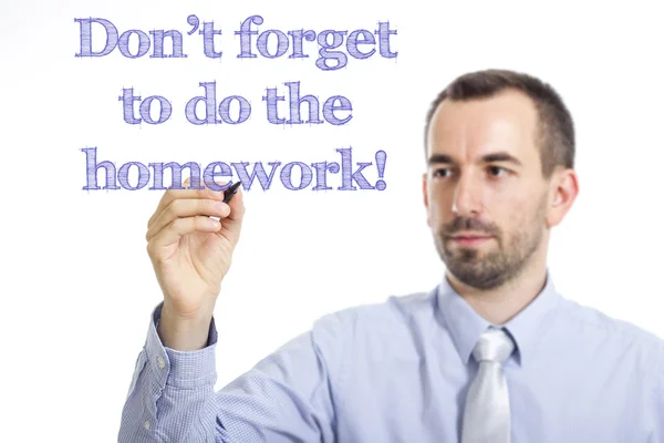 Vergessen Sie nicht, die Hausaufgaben zu machen! - Jungunternehmer schreibt blauen Text auf transparente Oberfläche — Stockfoto