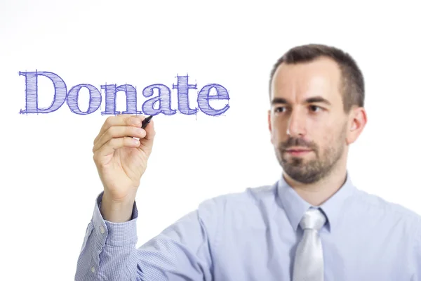 Donate - Giovane imprenditore che scrive testo blu su superficie trasparente — Foto Stock