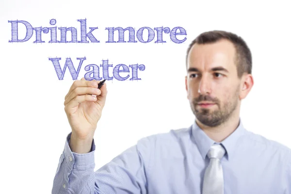 Drink more Water - Young businessman writing blue text on transparent surface — Stock fotografie