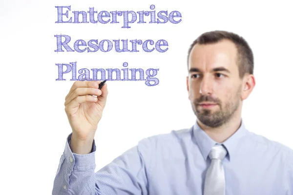 Planejamento de Recursos Empresariais ERP - Jovem empresário escrevendo texto azul em superfície transparente — Fotografia de Stock
