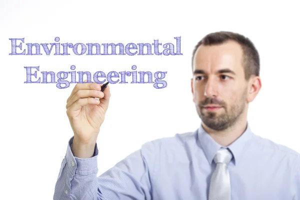 Environmental Engineering - Young businessman writing blue text — Stockfoto