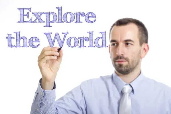 Explore o mundo - Jovem empresário escrevendo texto azul — Fotografia de Stock