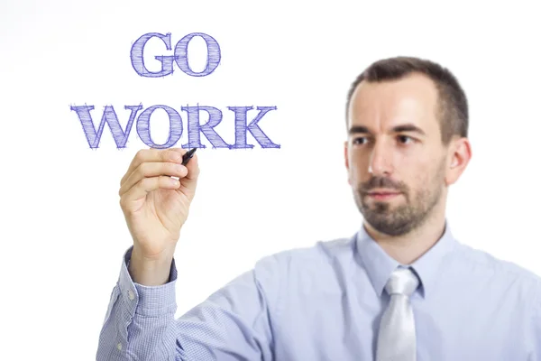 Go work - junger Geschäftsmann schreibt blauen Text — Stockfoto