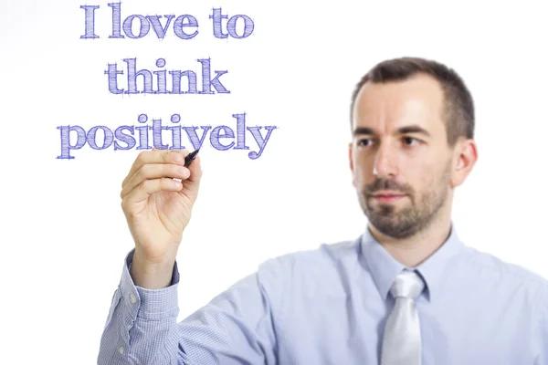 I love to think positively - Young businessman writing blue text — Stock Photo, Image