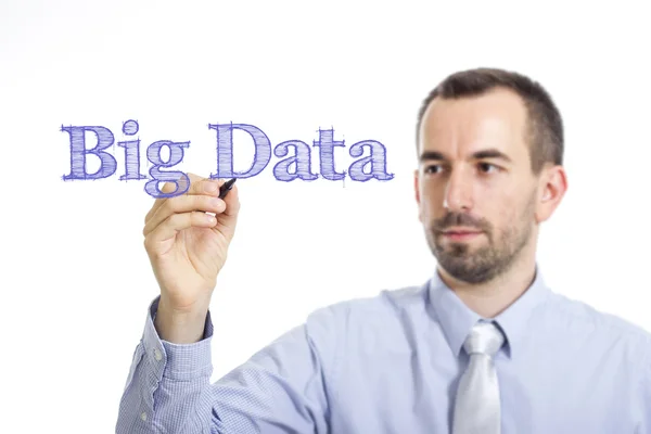 Big Data - Joven empresario escribiendo texto azul en superficie transparente —  Fotos de Stock