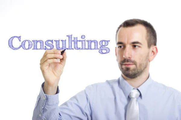 Consultoria - Jovem empresário com texto azul — Fotografia de Stock