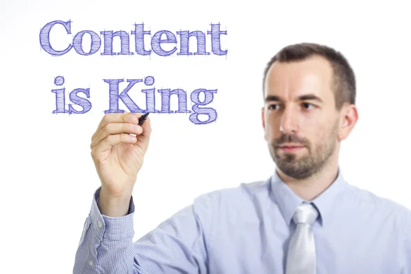 Content is King - Young businessman with blue text — Stock Photo, Image