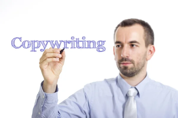 Copywriting - ung affärsman med blå text — Stockfoto